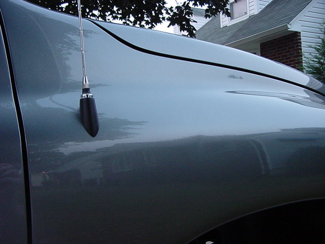 Passenger side fender dent