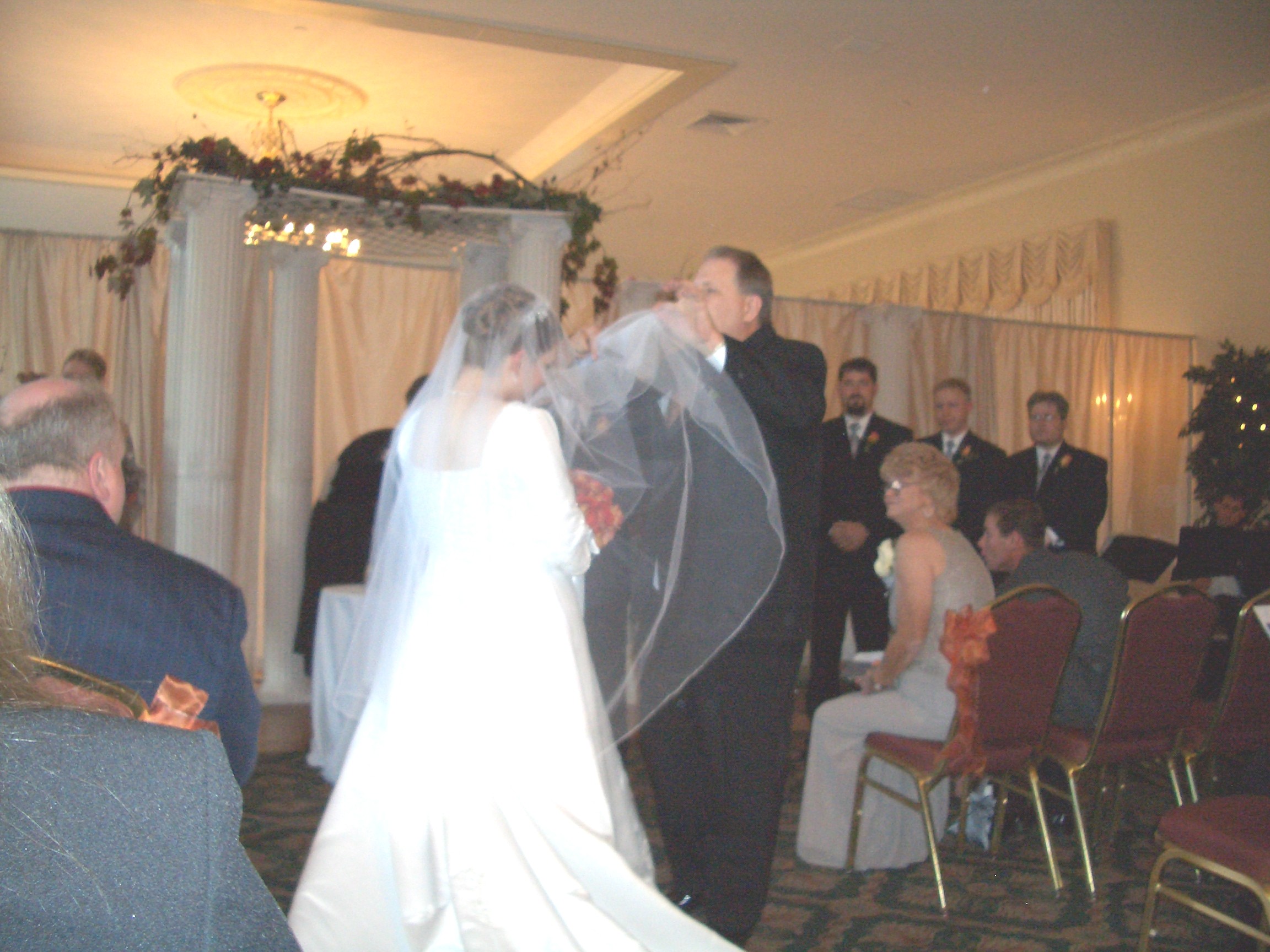 Marie's Dad removing her veil.