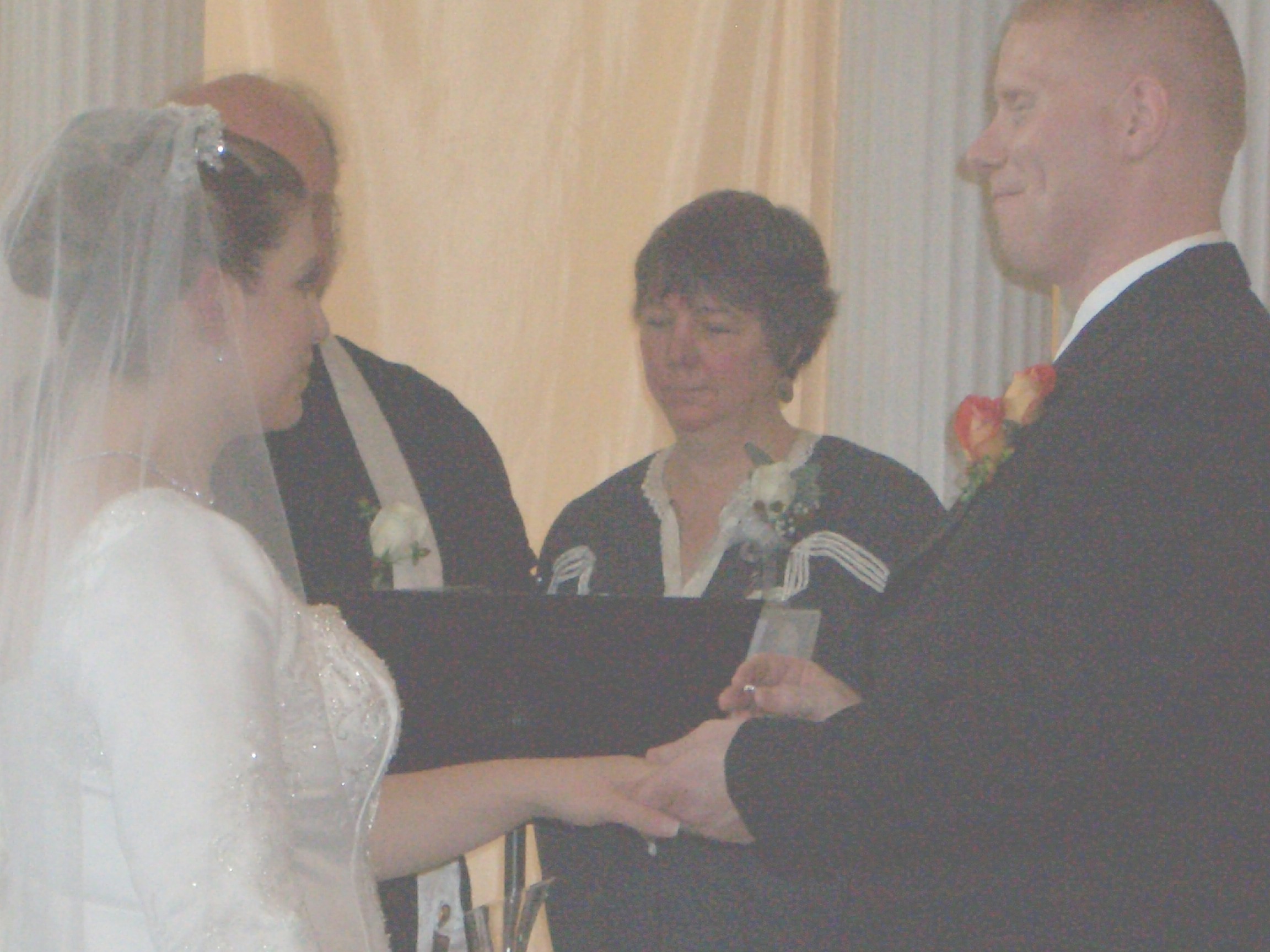 John placing Marie's ring on her finger ...