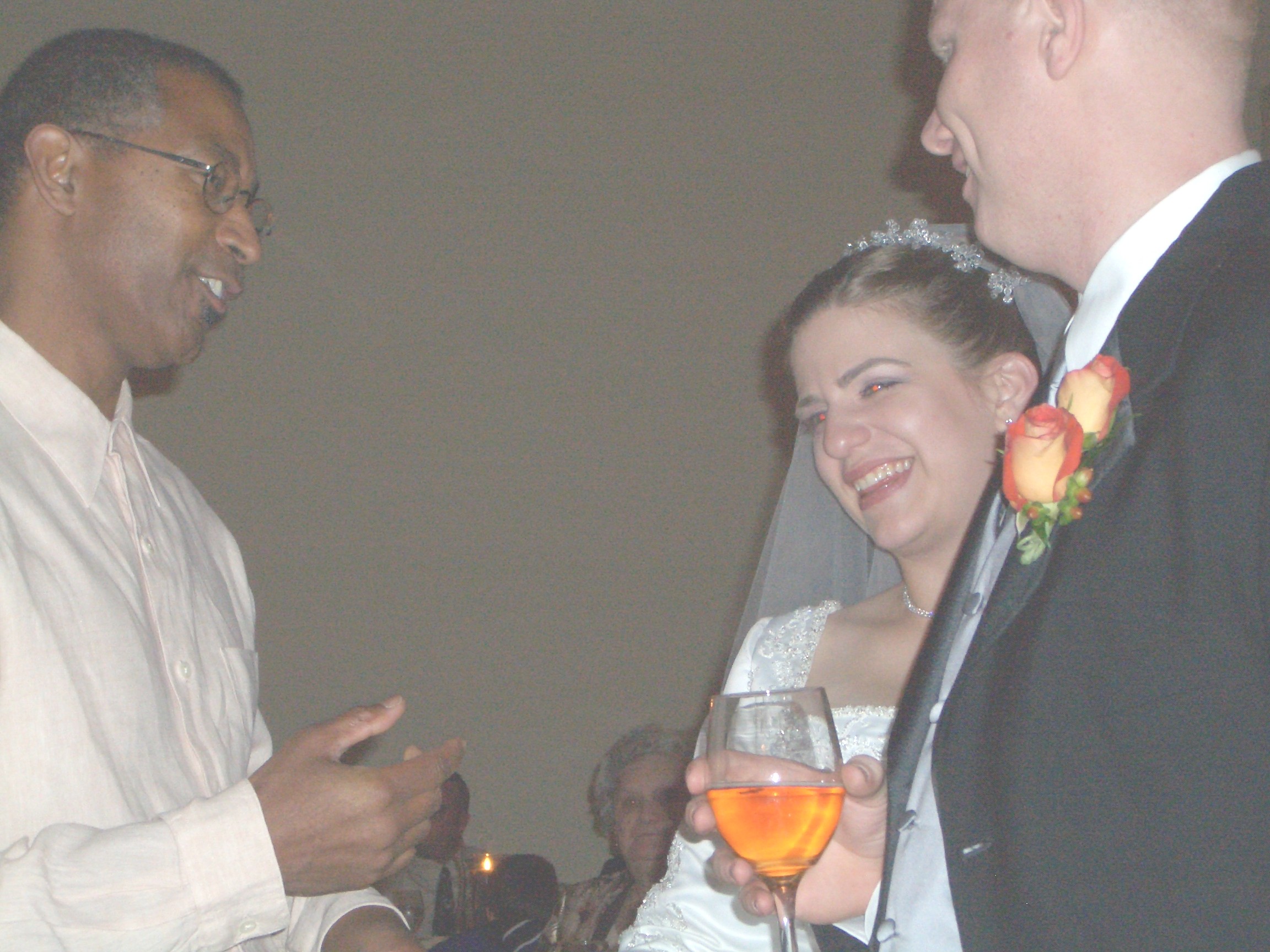 Bride and Groom greeting wedding guests.